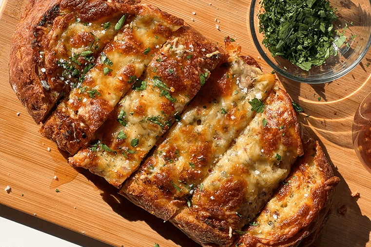 Cheesy Roasted Garlic Bread with Hot Honey Dipping Sauce by @nourishwithtan